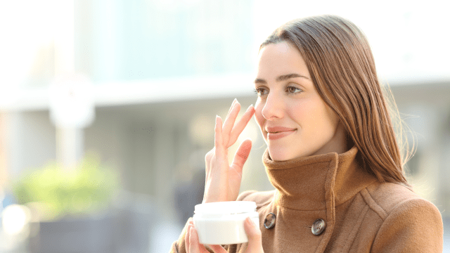 Tips for Healing Dry Winter Skin lady applying cream