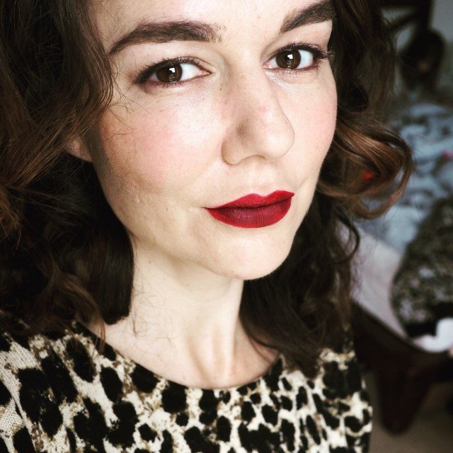 brown haired lady with red lipstick