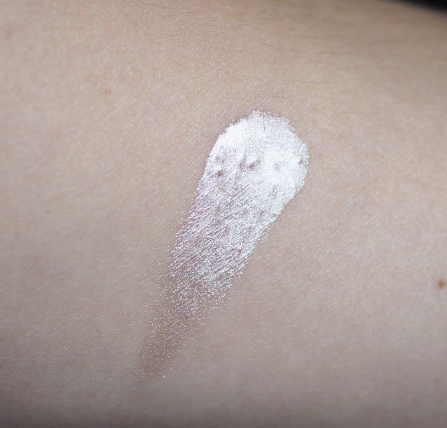 Makeup Revolution Liquid Starlight Highlighter Hand Swatch- a metallic white blob