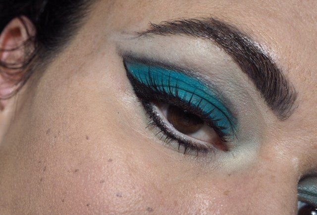 1960s Inspired Halloween Cat Makeup Tutorial- close up f eye with blue eyeshadow